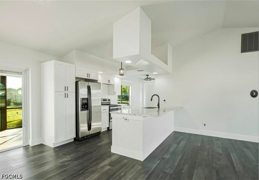 Welcome to this beautifully remodeled single-family home nestled - photo 2