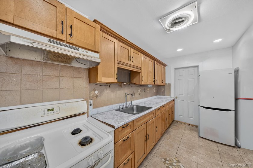 Solid brick home offering endless potential! Features include a - photo 9