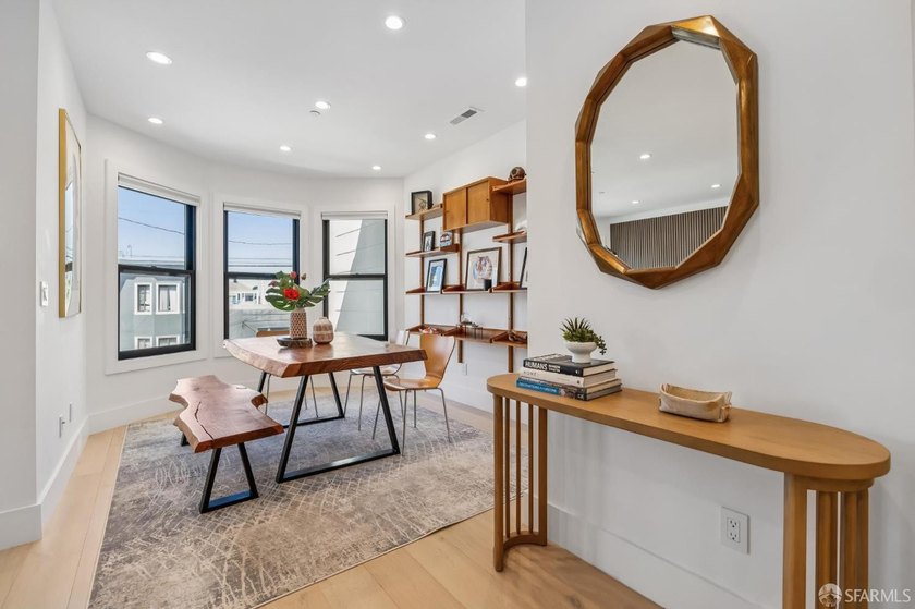 Thoughtfully renovated in 2023, this exceptional bi-level upper - photo 5