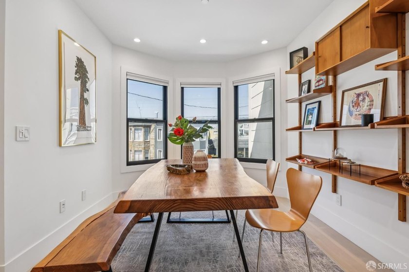 Thoughtfully renovated in 2023, this exceptional bi-level upper - photo 6