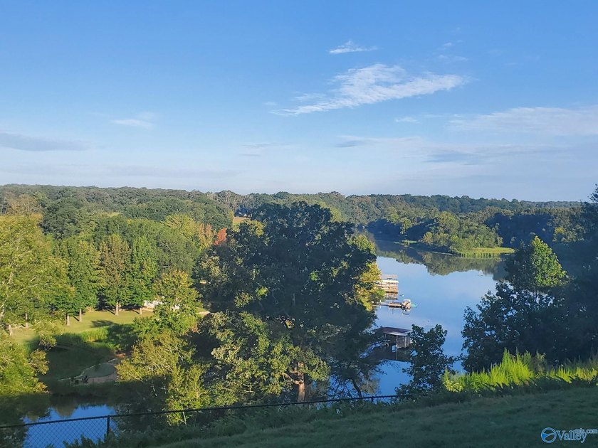 Private riverfront retreat on 10 acres along beautiful Bluewater - photo 4