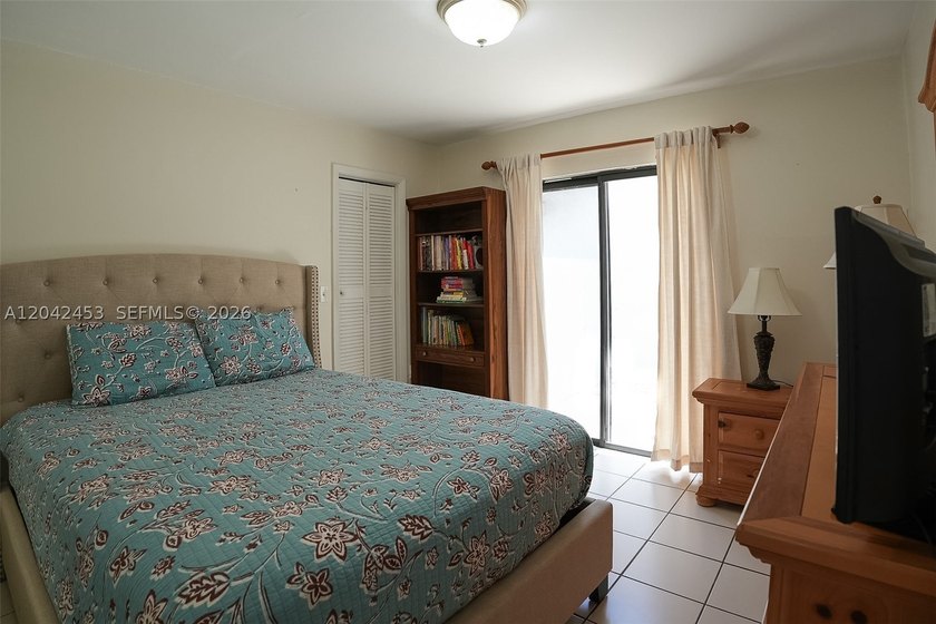 This charming 1988-built residence offers three bedrooms and two - photo 13