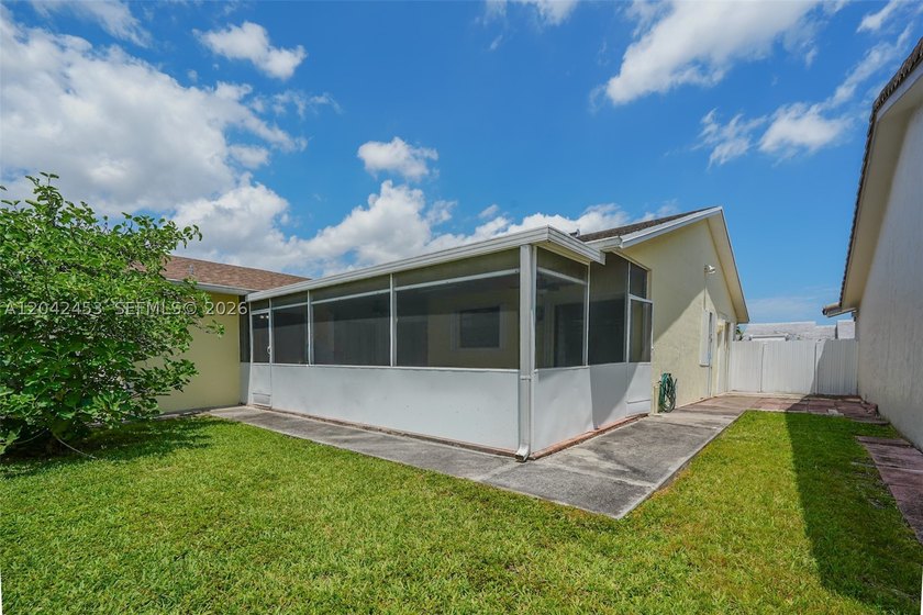 This charming 1988-built residence offers three bedrooms and two - photo 17