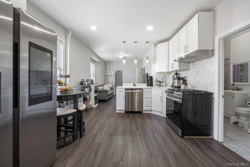 Welcome to this unique three-family home, a strong income - photo 15