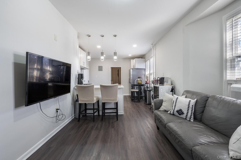 Welcome to this unique three-family home, a strong income - photo 20