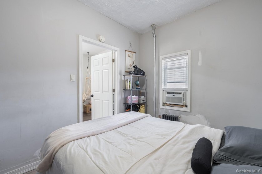Welcome to this unique three-family home, a strong income - photo 25