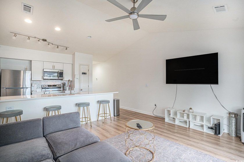 This top-floor remodeled, 1-bedroom, 1-bath condo offers a - photo 3