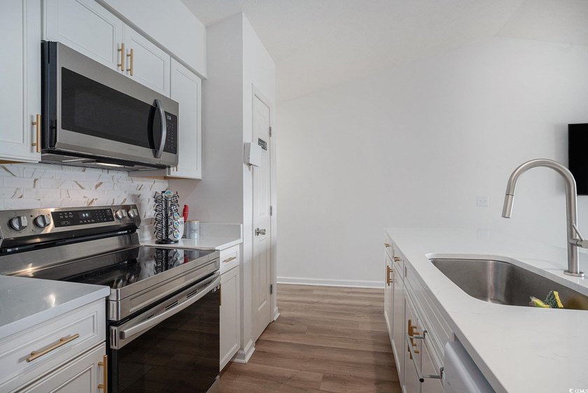 This top-floor remodeled, 1-bedroom, 1-bath condo offers a - photo 7