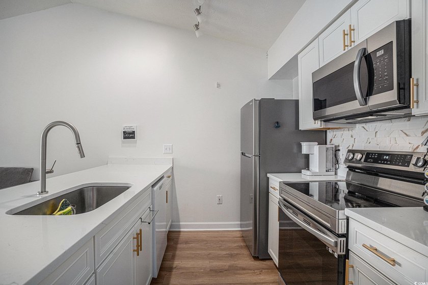 This top-floor remodeled, 1-bedroom, 1-bath condo offers a - photo 8