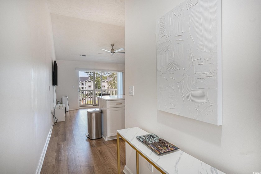 This top-floor remodeled, 1-bedroom, 1-bath condo offers a - photo 9
