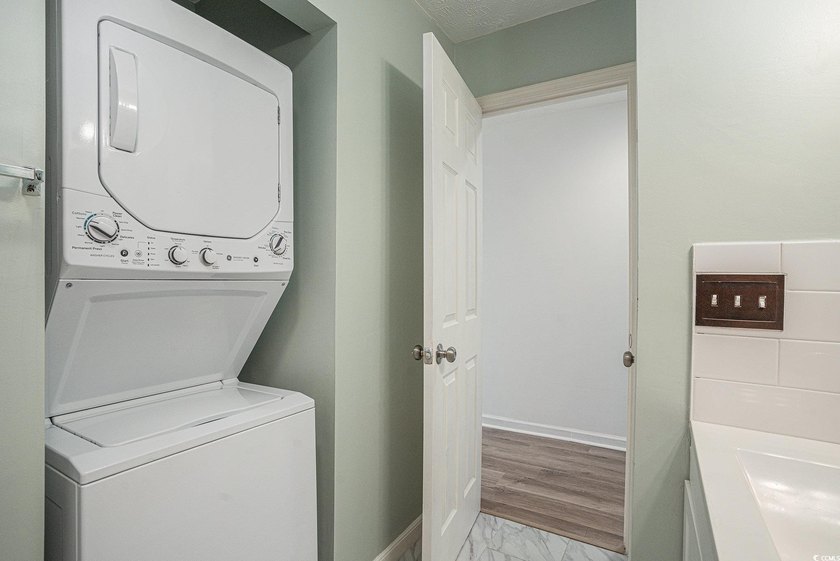 This top-floor remodeled, 1-bedroom, 1-bath condo offers a - photo 10