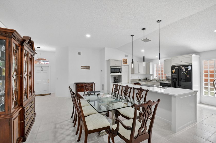WOW - Awesome pool home with renovated kitchen, flooring and - photo 8