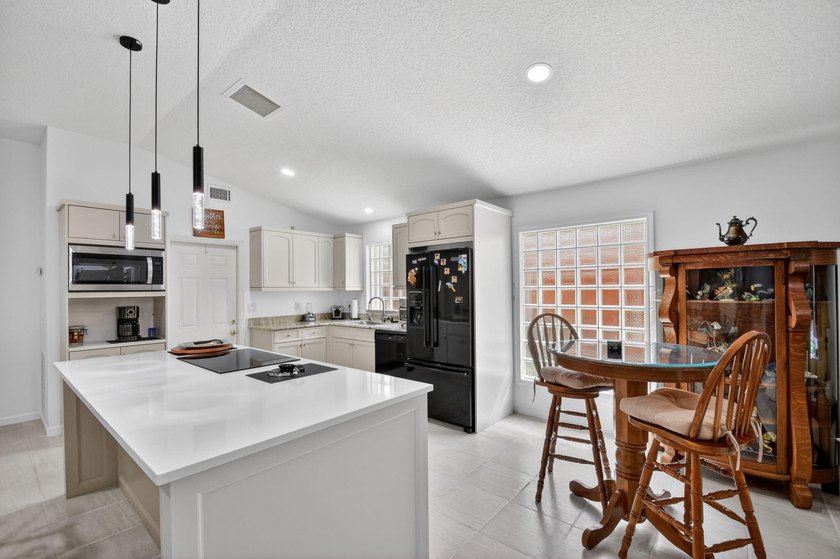 WOW - Awesome pool home with renovated kitchen, flooring and - photo 9