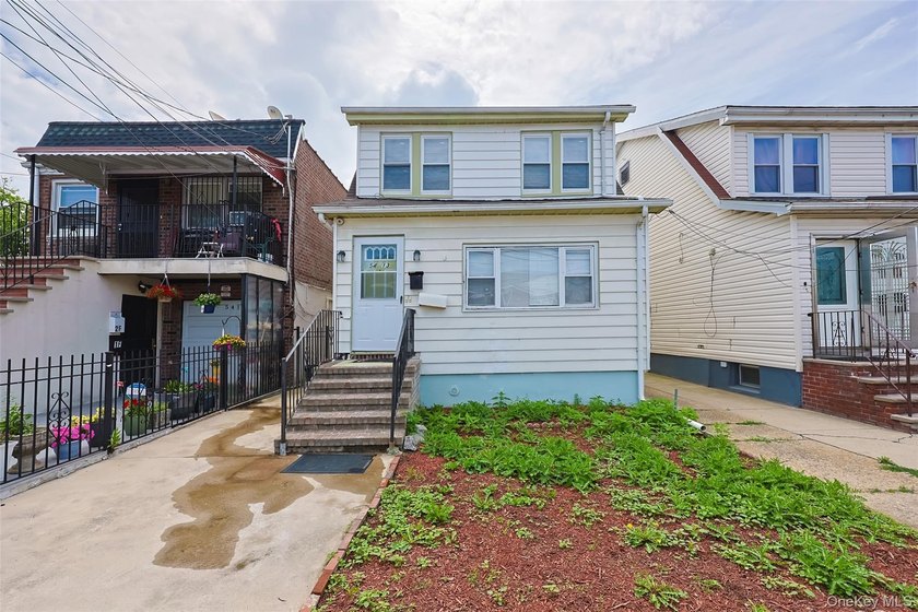 Welcome to this beautifully renovated detached 2-family home in - photo 5