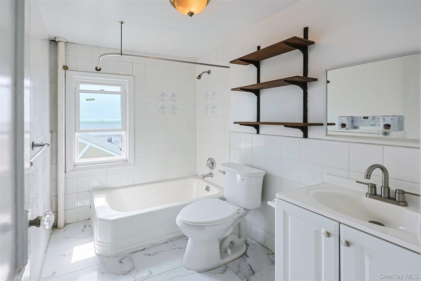 Welcome to this beautifully renovated detached 2-family home in - photo 10