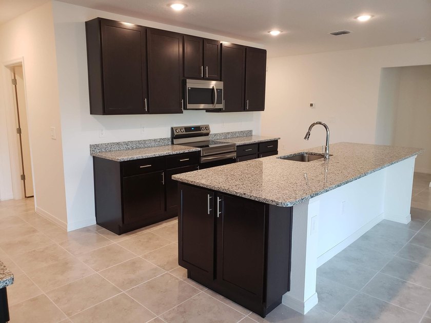 Lowest priced 4 bedroom home in Crosstown Commons. Upgraded - photo 11