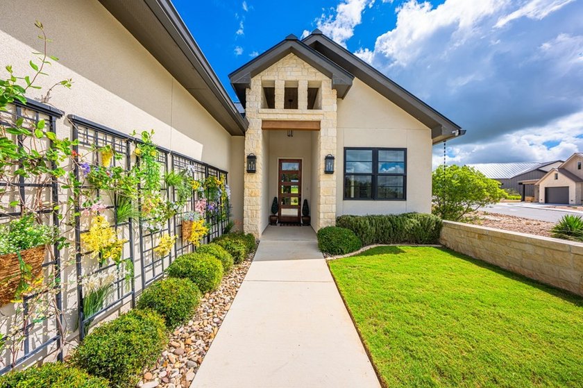 Experience luxury Hill Country living in this stunning rock &amp; - photo 10