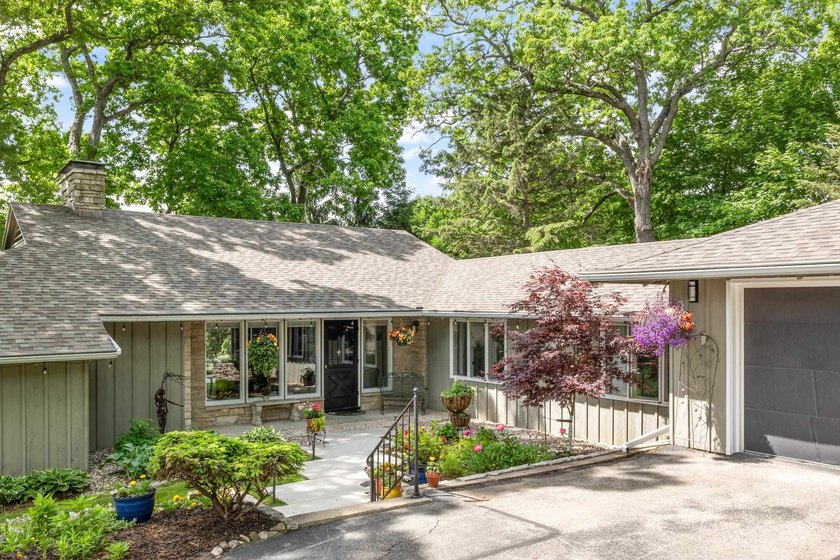 This 4-bedroom, 3-bath midcentury lake home offers 100 feet of - photo 4