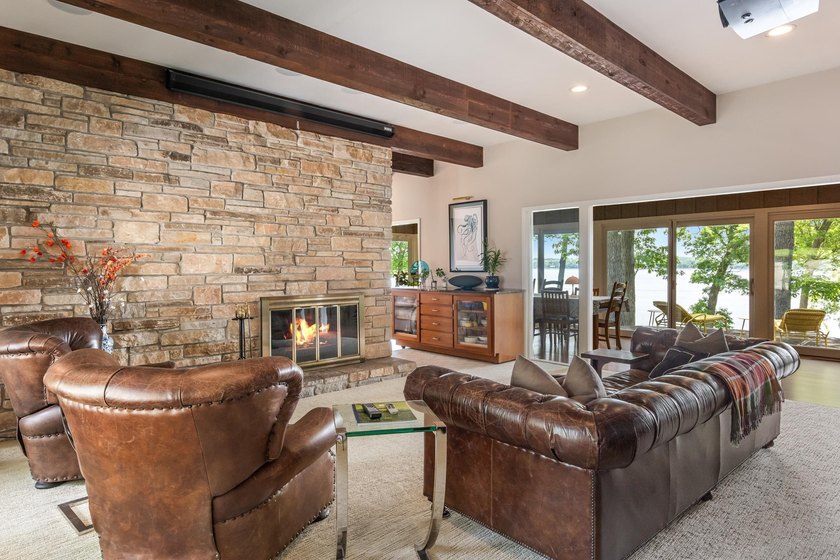 This 4-bedroom, 3-bath midcentury lake home offers 100 feet of - photo 9