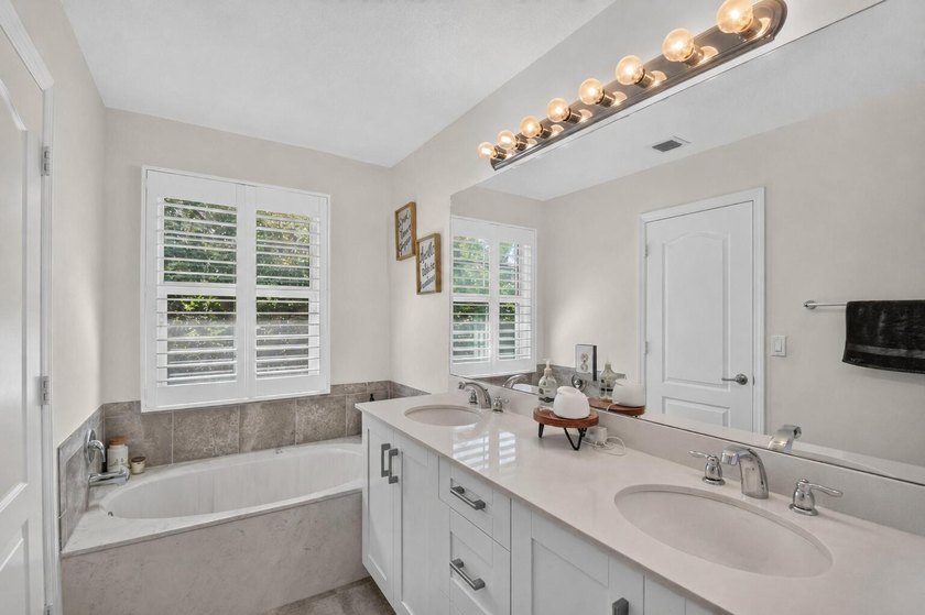 Newer construction, builder-upgraded townhome maintained in - photo 16