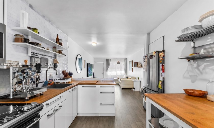 Welcome to your turn-key coastal retreat at 645 NE 77th Street - photo 3
