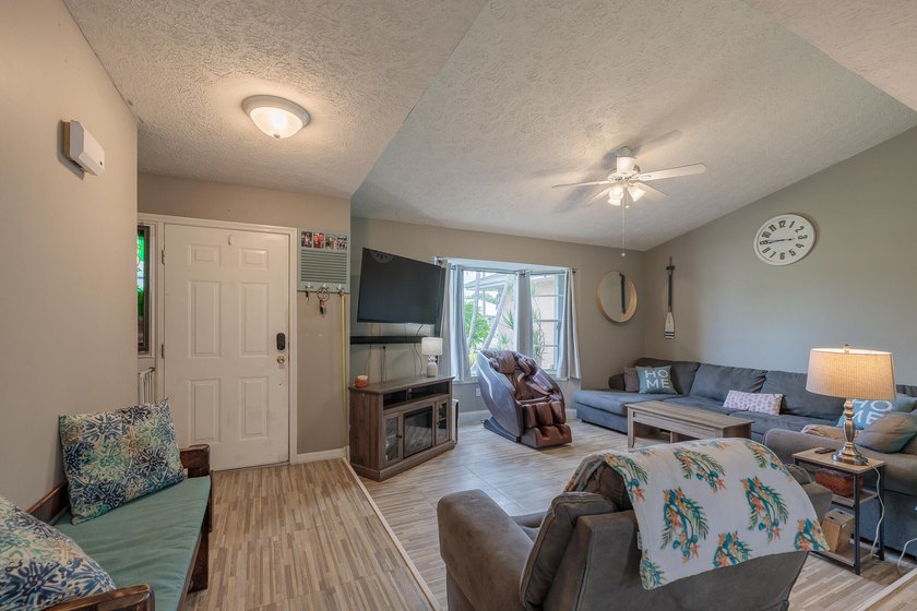 Welcome to this charming 2-bedroom, 2-bath pool home in the - photo 3
