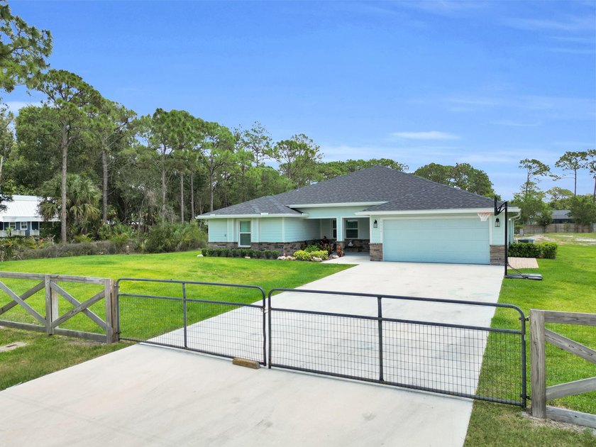 Welcome to this one-of-a-kind custom estate located in the - photo 2