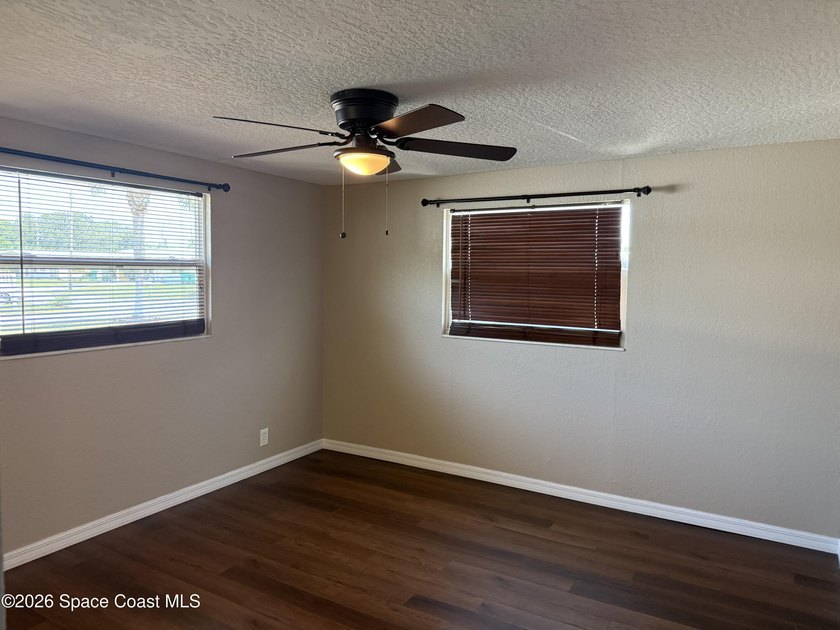 Step inside to find tile flooring flowing throughout the main - photo 15