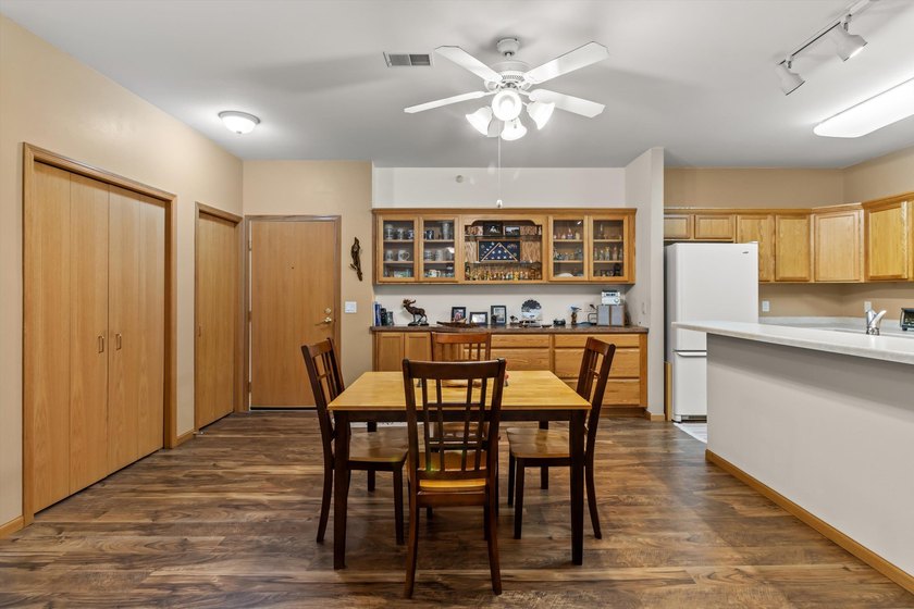 Welcome home to this bright and airy 55+ condominium in the - photo 3