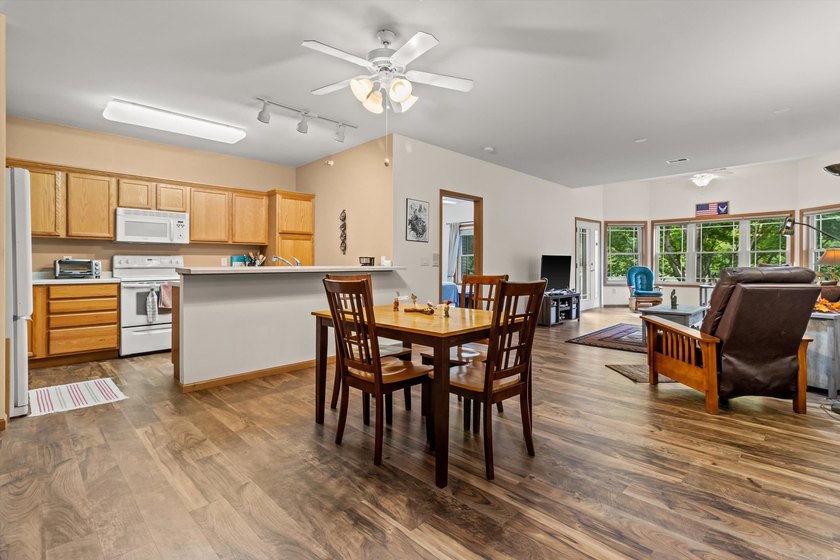 Welcome home to this bright and airy 55+ condominium in the - photo 5