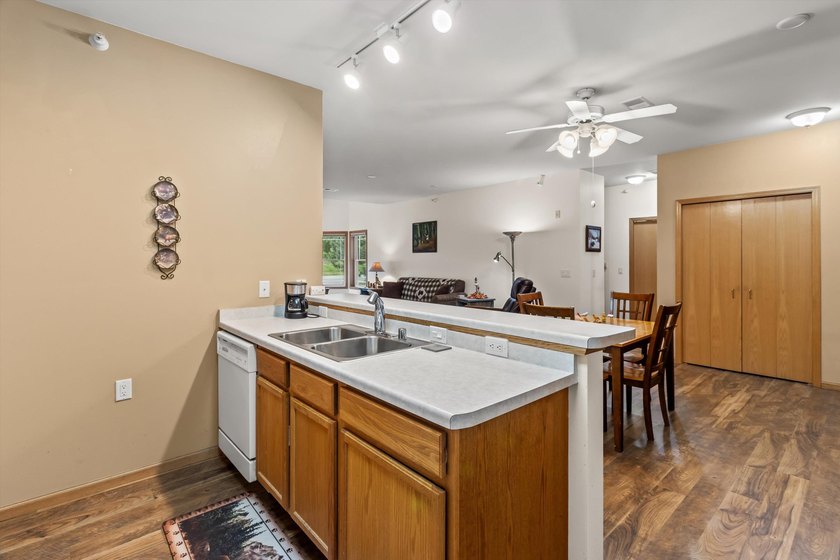 Welcome home to this bright and airy 55+ condominium in the - photo 8