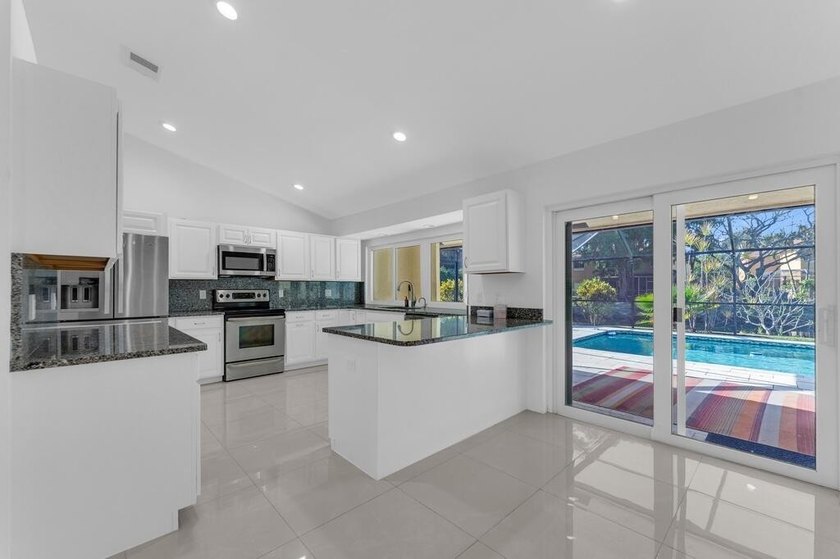 This stunning 4-bedroom, 2-bath pool home in the heart of Coral - photo 13