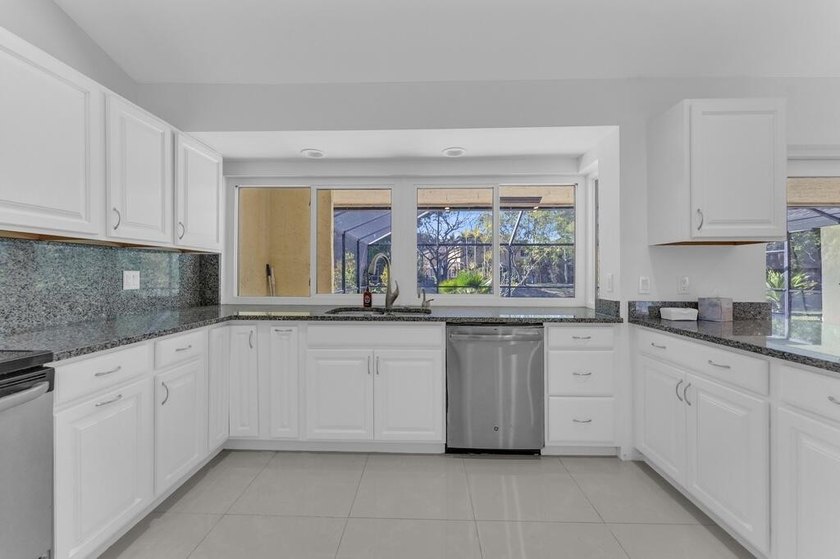 This stunning 4-bedroom, 2-bath pool home in the heart of Coral - photo 15