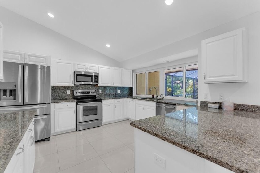 This stunning 4-bedroom, 2-bath pool home in the heart of Coral - photo 19