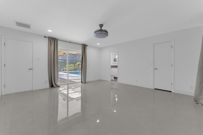 This stunning 4-bedroom, 2-bath pool home in the heart of Coral - photo 22