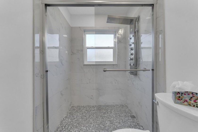 This stunning 4-bedroom, 2-bath pool home in the heart of Coral - photo 34