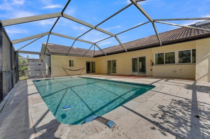 This stunning 4-bedroom, 2-bath pool home in the heart of Coral - photo 39