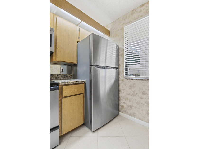 This inviting first-floor, two-bedroom, two-bath condo offers a - photo 7
