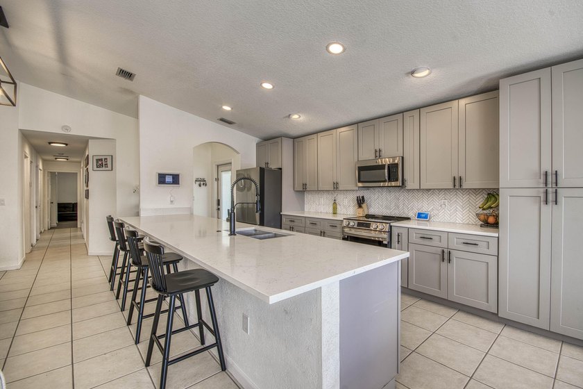 Beautifully updated 4-bedroom, 2-bath home featuring a brand-new - photo 7