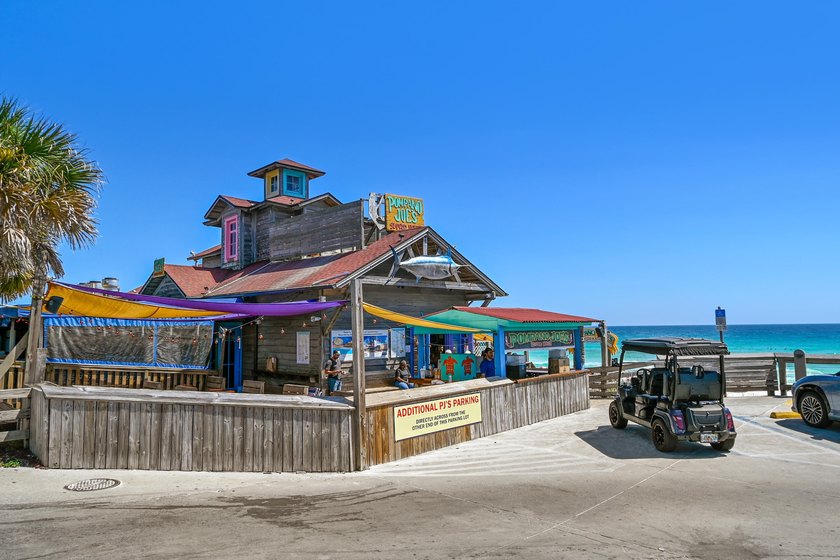 Gulf views take center stage in this beautifully updated - photo 39