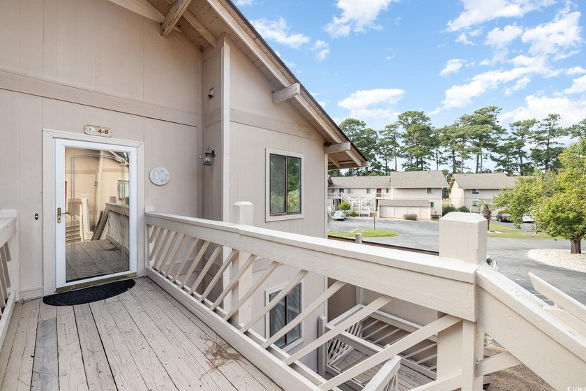 Welcome to this charming two-bedroom, two-bathroom end-unit - photo 4