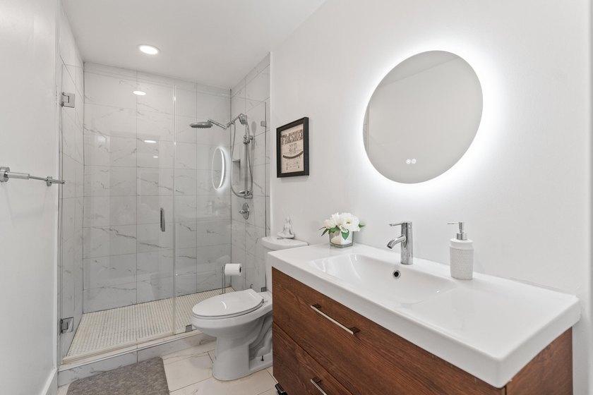 Completely remodeled and designed for luxury living, this - photo 27
