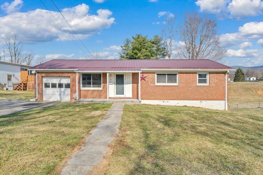This one-level brick ranch offers plenty of potential and is - photo 2