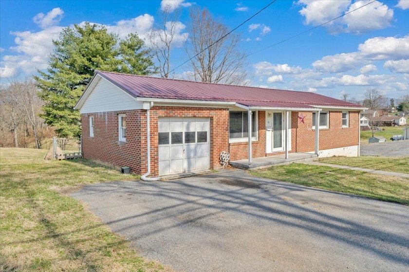 This one-level brick ranch offers plenty of potential and is - photo 3