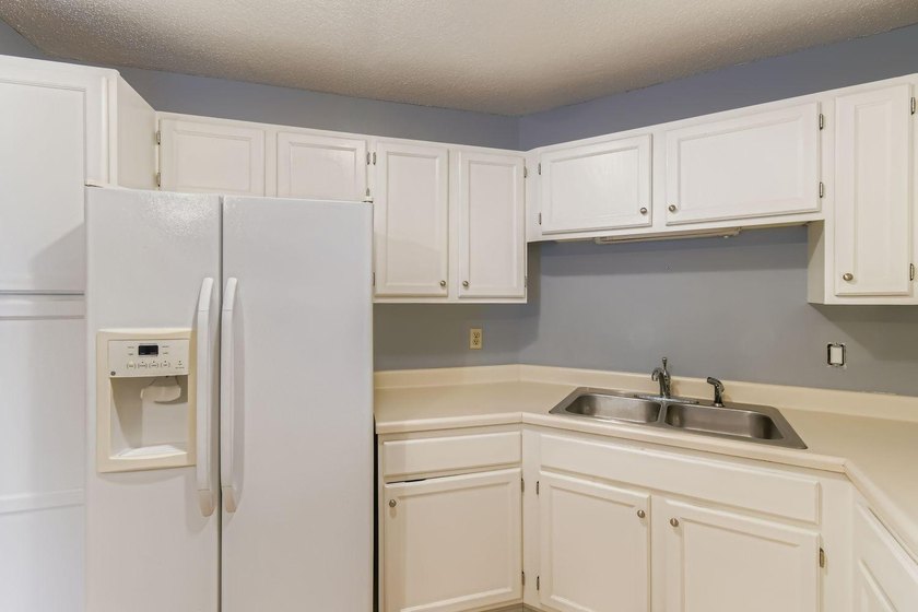 Welcome to Unit 401 at 6500 Woodlake Drive, an inviting - photo 11