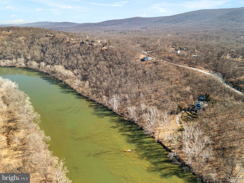 Discover the potential of this 4.9+/- acre waterfront parcel on - photo 3