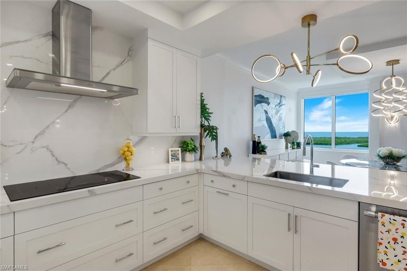 Sweeping Gulf and Bay views set the stage for this beautifully - photo 10