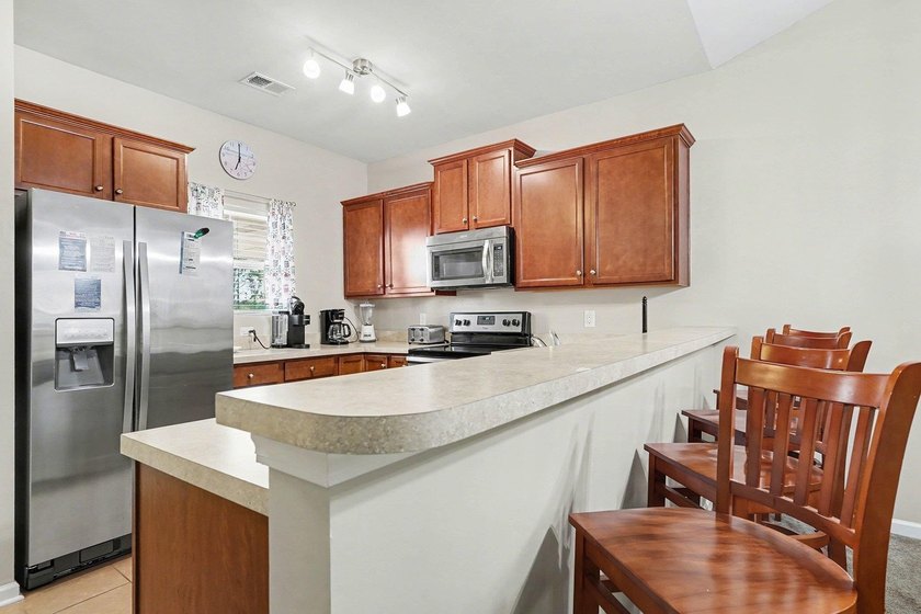 Welcome to this beautifully furnished third-floor condo located - photo 12