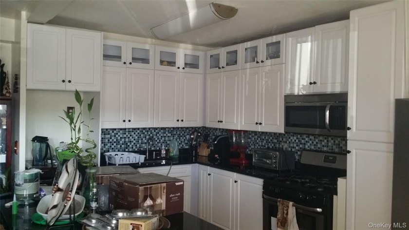 Well-maintained two-bedroom, one-and-a-half-bath condominium - photo 2