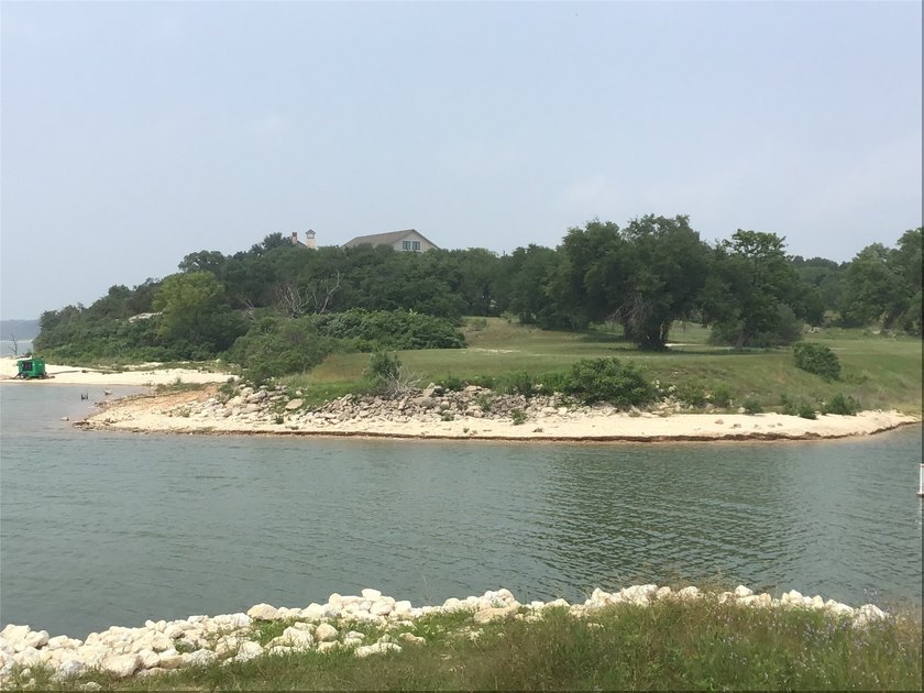 Great Lot with distant water view, partially cleared, backs up - photo 24